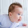 smiling-baby-tummy-time-istock-medium
